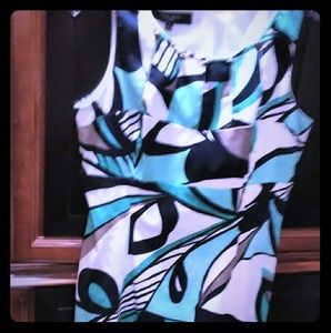 Cute cute dress!  Hang right above the knee.